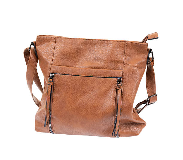 Brown leather women handbag isolated on white background.
