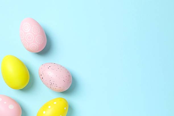 istock Happy Easter. Colorful eggs on color background, space for text or advertising 2254225293