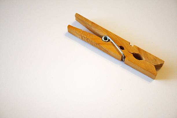 istock Minimal choice and simplicity concept with single wood- material clothespin 2254225330