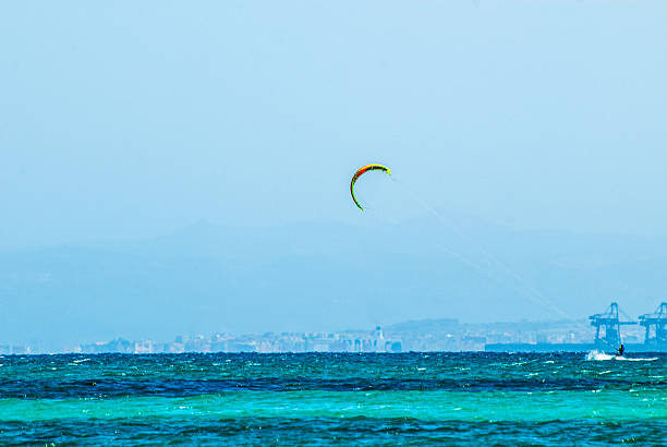 Windsurfing  in the merald sea at Ezzi Mannu, Pazzona beach, Sardinia, Italy