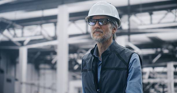 istock Experienced Male Executive Walking Through Modern Factory 2254228696