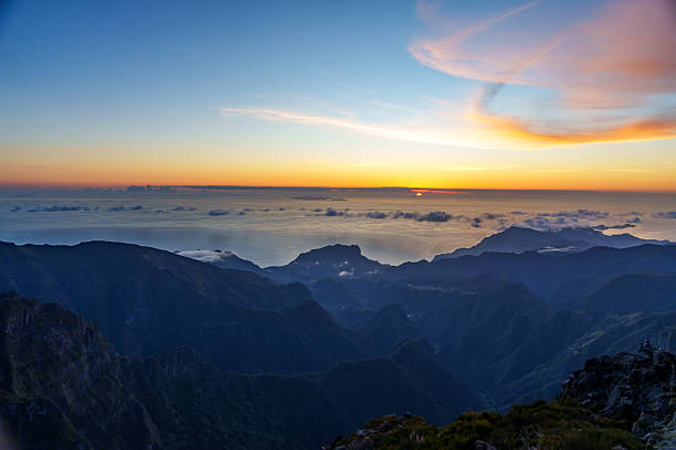 Sunset at Cristo Rei Beach or Praia do Garajau on Madeira island during summer. Long exposure image.