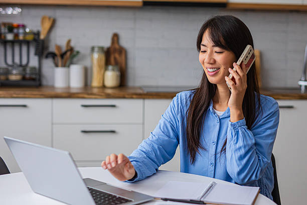 istock Woman Talking on Phone During Work from Home 2254238824