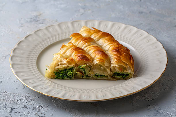 istock Turkish Tepsi Boregi, Round Borek, Tray pastry (Turkish name; rulo borek - ispanakli borek) 2254241055