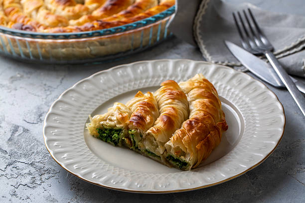 istock Turkish Tepsi Boregi, Round Borek, Tray pastry (Turkish name; rulo borek - ispanakli borek) 2254241126
