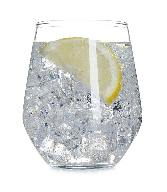 istock Refreshing water with lemon and ice isolated on white 2254242845