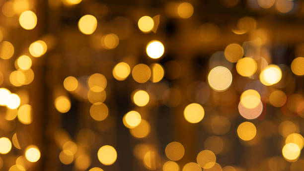 istock Warm Festive Illumination, Soft Glowing Lights Create Inviting Atmosphere, Golden Light Circles Produce Charming Glow For Seasonal Decorations And Warm Interiors 2254243056