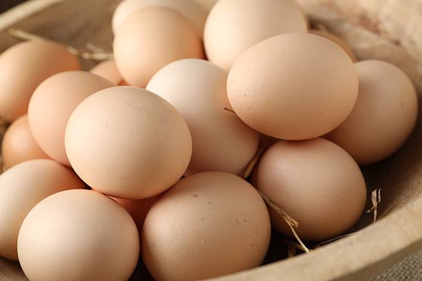 istock Many raw chicken eggs in bowl, closeup 2254243319