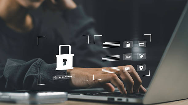 istock Cybersecurity concept with access control and password protection. A hand typing on laptop with lock icon and digital security interface. 2254243646