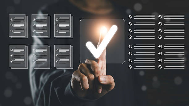 istock Finger pressing a digital check mark symbol on a virtual checklist, representing audit, compliance, data security, quality control, and systematic document verification in business environments. 2254243656
