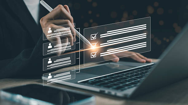 istock Digital checklist system with user profiles, showing approval and compliance assessment for employee or client performance review on a laptop. 2254243671
