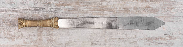 Spartan iron sword medieval weapon on wooden background