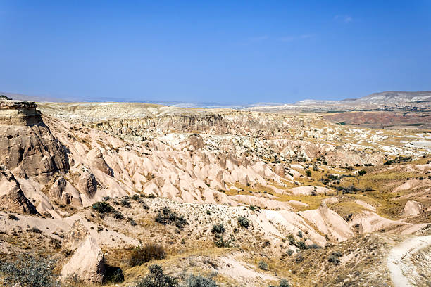 Cappadocia, a semi-arid region in central Turkey, is known for its distinctive “fairy chimneys,” tall, cone-shaped rock formations clustered in Monks Valley, Göreme and elsewhere.