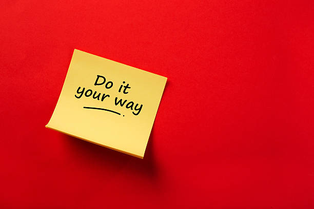 istock Yellow sticky note reading do it your way on red background 2254248594