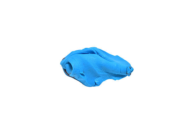 A piece of blue plasticine isolated on a white background.
