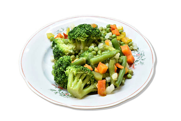 Ready to eat vegetables on a plate isolated on a white background.