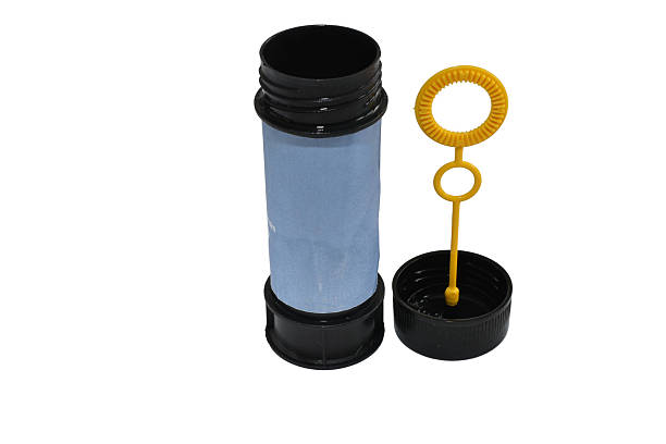 A container with soap liquid for creating air soap balloons on a white background.