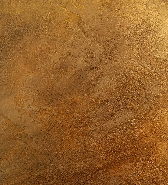 bronze plastered wall covered with decorative stucco