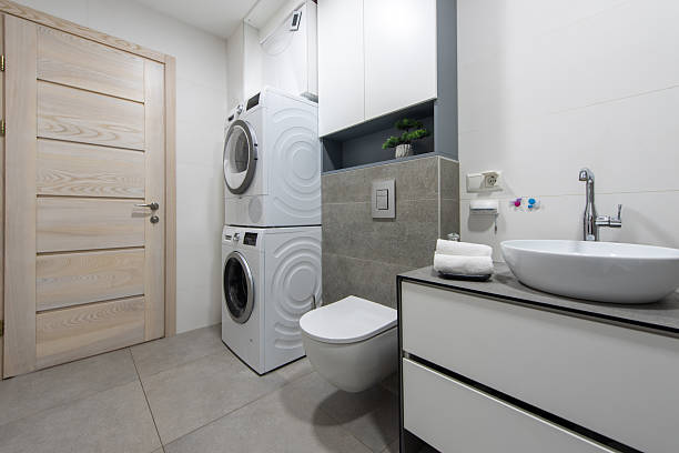 istock Modern Bathroom Interior with Laundry Equipment and Stylish Design Elements 2254255961