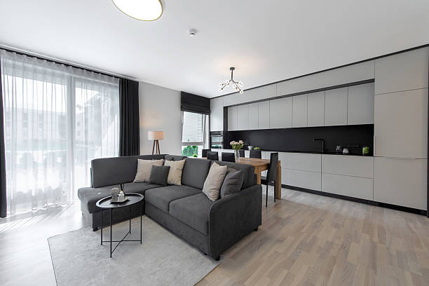 istock Modern Kitchen Interior with Wooden Dining Table and Leather Chairs 2254256025