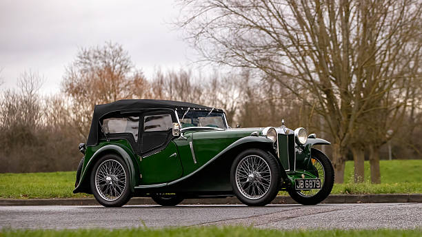Milton Keynes,Bucks,UK - Jan 1st 2026:  1935 green MG Midget Tourer classic car driving on a British road