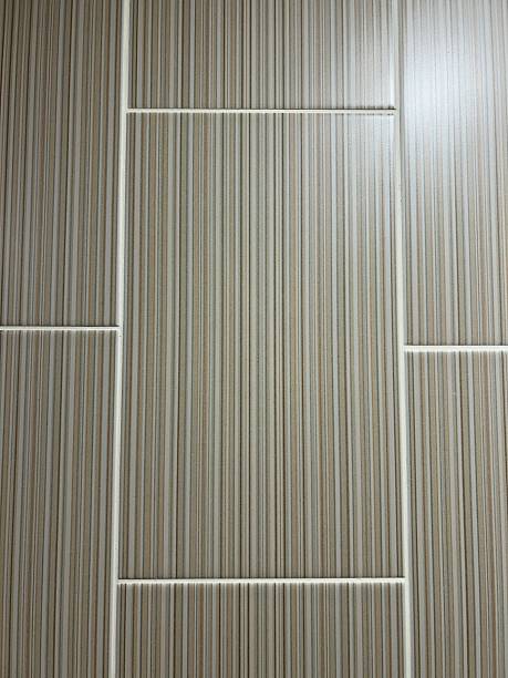 istock Vertical Striped Wall Tiles in Beige Tones with White Grooved Lines 2254257819