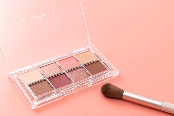 istock Eyeshadow and makeup brushes on a pink background 2254259535