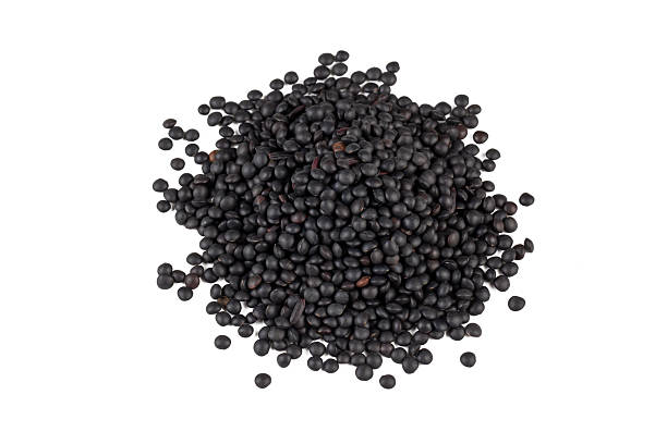 istock Dried black lentil on the white background 2254261354