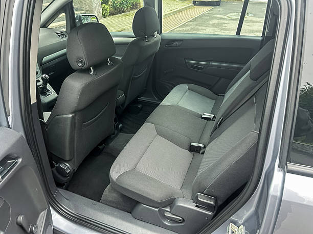 istock Exploring the interior of a modern vehicle with spacious seating and sleek design elements at a parked location on a clear day 2254263118
