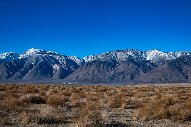 sierra nevada mountains with desert valley in foreground