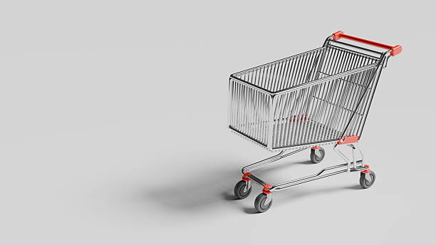 istock shopping cart stands alone on a flat surface with a plain background. cart is metallic with a red handle. It is empty and not in use at this moment 2254269267