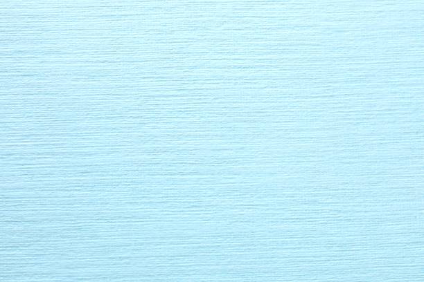 Blue paper background, abstract colored background, top view and flat lay