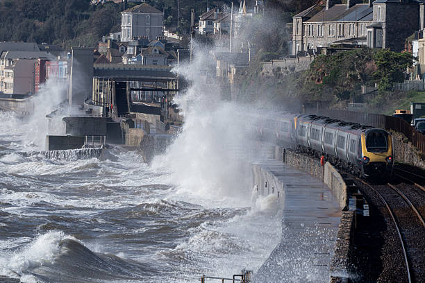 istock Intercity train leaving Dawlish station in a storm 2254278618