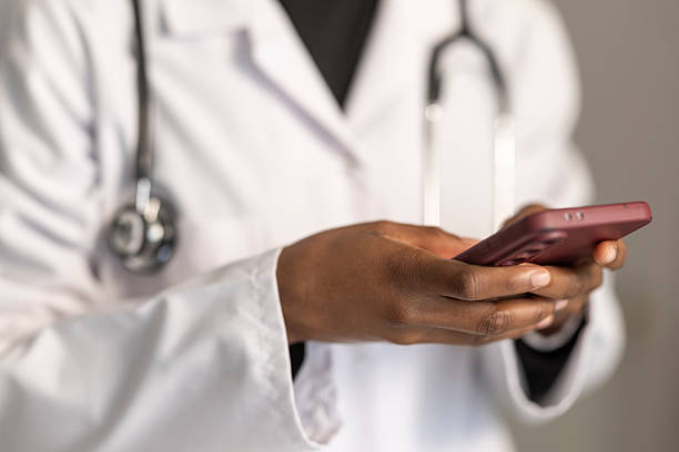 istock Doctor hands using smartphone for telemedicine concept 2254280280