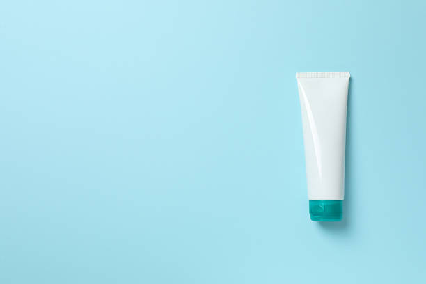 istock Cosmetic tube on blue background 2254280425