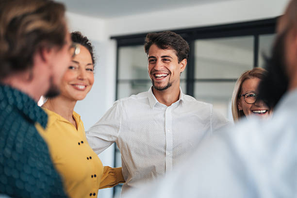istock Business team embracing after achieving goals 2254280882