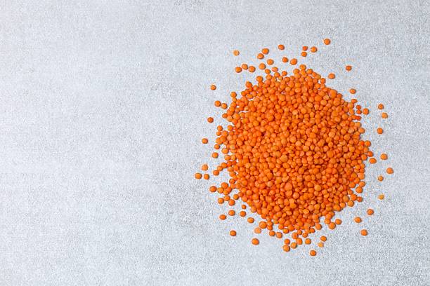 istock Red lentils on a gray background 2254283691
