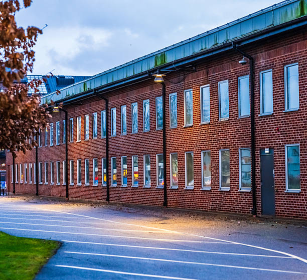 Red brick industrial office building with uniform window rows