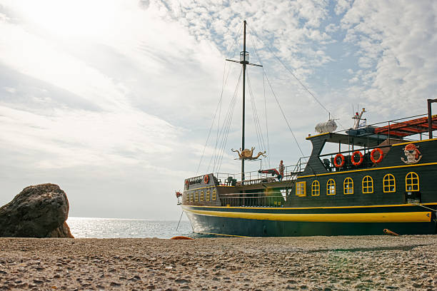 Traveling by excursion cruise boat during holidays in Greece. Leisure boat trip as an optional tour, combining sightseeing, sea views, relaxation, and coastal exploration in a Mediterranean destination.
