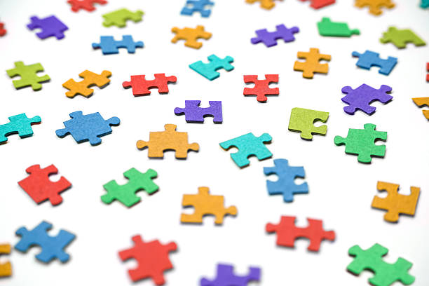 4 stacks of colorful puzzle pieces in corners