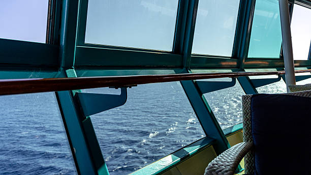 Cruise ship interior lounge offering a wide ocean view from large windows