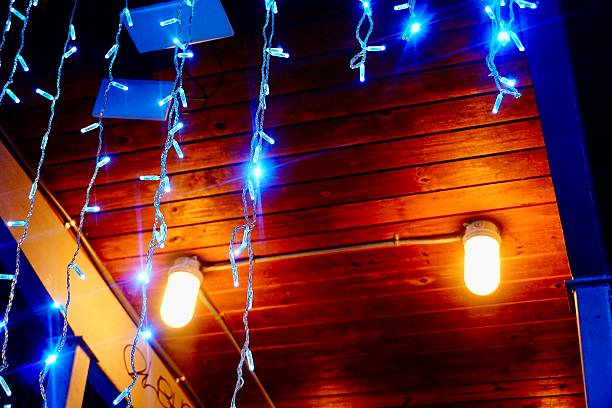 Festive blue lights sparkle as they hang from a pavilion