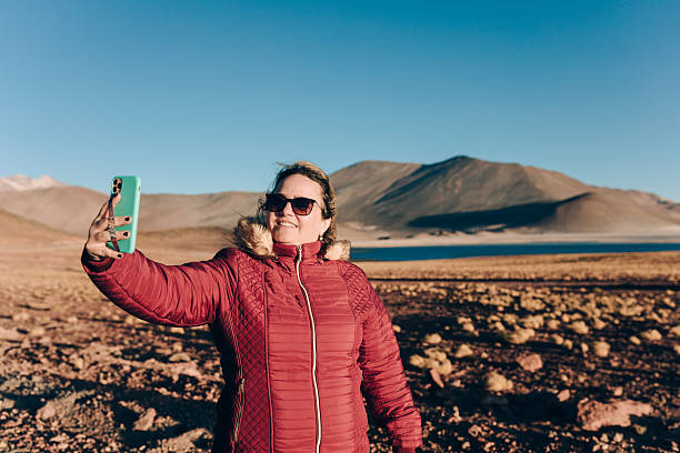 istock Woman taking a selfie at Atacama desert 2254293453