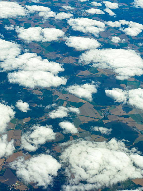 istock Scattered clouds above patchwork fields during a clear day in early afternoon over rural landscape 2254295563
