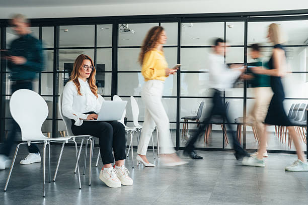 istock Focus in Motion - Busy modern workplace 2254296639