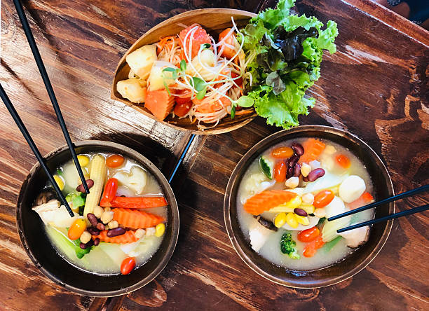 Vegetable Soup Bowls With Chopsticks And Papaya Salad Flat Lay