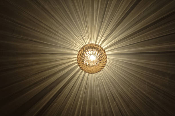 Textured Glass Ceiling Lamp Casting Radial Starburst Light Rays