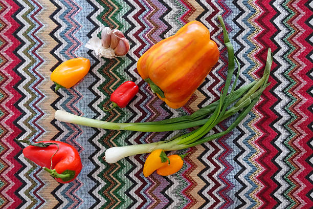 Fresh Vibrant Vegetables Arranged Beautifully on Colorful Textile