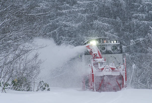 Nikii-cho, Hokkaido, Japan - January 1, 2026 : Snow removal train to fly snow runs on the Hakodate line