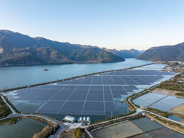 istock Floating solar farm by mountain lake 2254304038